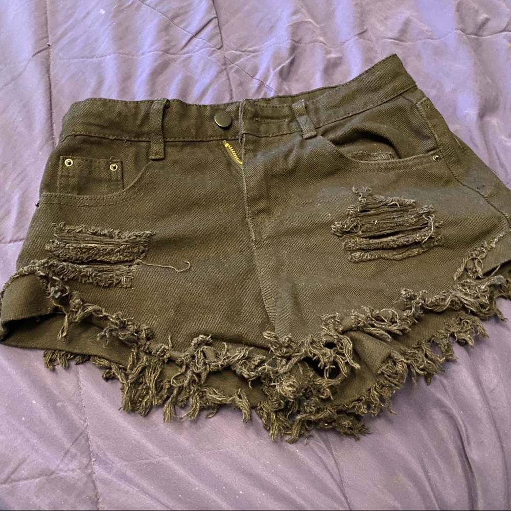 Distressed black booty shorts